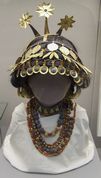 Reconstructed sumerian necklaces and headgear discovered in the tomb of Queen Puabi. British Museum.